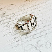 Close-up of Hermès buckle ring in sterling silver