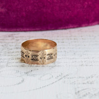 Wide gold antique cigar band ring with floral and foliate panels