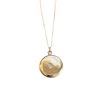 14k gold round antique locket with center starburst detail