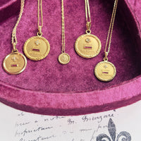Heirloom-style French love token pendant with sentimental inscription and elegant gold setting