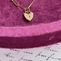 Necklace styled against velvet backdrop for a romantic, vintage-inspired look