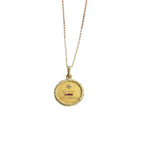 Close-up of petite antique 18K gold French love token pendant with diamond and ruby on 14K gold chain