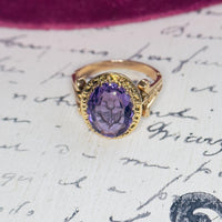 Antique 14k gold amethyst flower ring styled on white background