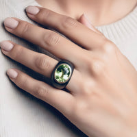 Image of model wearing 18k gold peridot ring