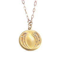 Round gold-filled WH & Co. paste locket