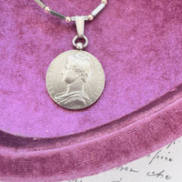 Close-up of A. Borrel signed French coin pendant in sterling silver