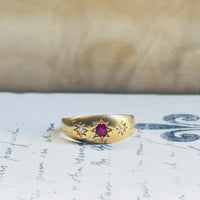 Antique Victorian ruby and diamond three-stone ring in 18k yellow gold, flush gypsy setting, hand-engraved star detail, hipV Vintage