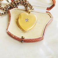 Antique heart locket in 10k yellow gold with old cut diamond center stone