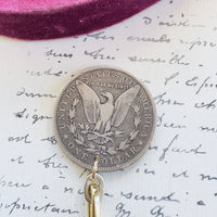Back detail showing eagle reverse on 1884 silver dollar pendant