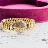 Vintage Carmen D.F.B. Co. gold-filled sweetheart bracelet with raised double-heart plaque.