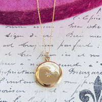 Classic 14k gold photo locket with starburst front