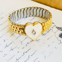 Co-Star vintage bracelet with sculptural gold links and heart center