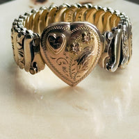 Collectible signed Jewel Guild sweetheart bracelet, gold filled over sterling with hand-engraved floral scrollwork and pink enamel flower heads