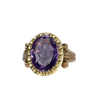 Close-up of 14k gold amethyst ring with carved floral intaglio