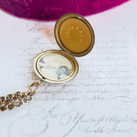 Antique equestrian locket on 12K gold watch chain