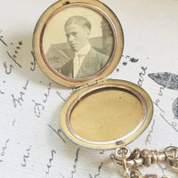 Edwardian celestial locket opened to reveal the original photograph preserved inside for more than a century.
