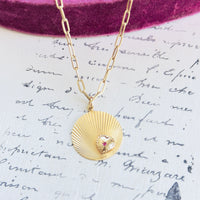 Fluted gold disc charm layered on paperclip chain