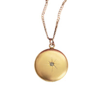 Gold-filled starburst locket with center paste stone by W.H. & Co.