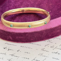 Gold filled Winard bangle showing florentine finish and etched starbursts