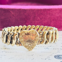 Gold filled sweetheart bracelet with heart shaped center and floral engraving