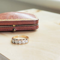 Mid-century five-diamond band with geometric shank details and 0.70 CTW stones