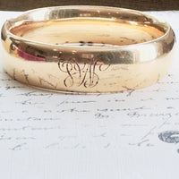 Back view showing engraved “ML” monogram on polished surface.