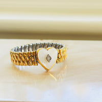 Mother of pearl heart bracelet with gold filled links close up