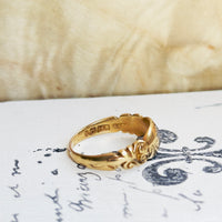 Overhead view of c.1897 Birmingham hallmarked 18k gold diamond flower ring, substantial domed band