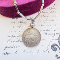 Reverse of French silver coin necklace showing A. Jouclas 1912 inscription