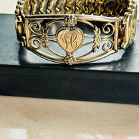 Side view of Leading Lady sweetheart bracelet showing heart medallion and expansion links"
