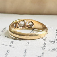 Top view of an Art Deco diamond ring showing the sculpted gold band and diamond placement