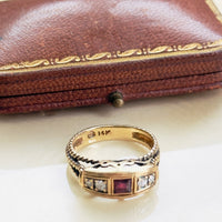 Vintage 14K gold ruby ring with diamond accents and sculptural setting