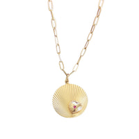 Vintage 14k gold fluted disc necklace with ruby heart detail