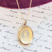 Vintage oval horseshoe locket on sterling and gold overlay chain