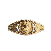 Edwardian gold filled lion head bangle with pierced scroll shoulders, antique hinged bracelet circa 1910