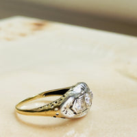 three-diamond ring with white gold bezels and yellow gold band