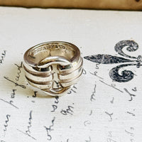 Tiffany Atlas ring angled to show the signed Tiffany & Co. 925 hallmark inside the band