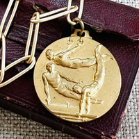 Gymnastics pendant necklace with paper clip chain.