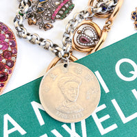 Vintage necklace with Qing Dynasty pendant on silver chain.