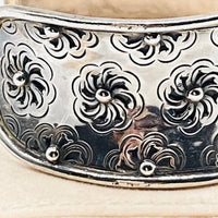 Wide floral sterling silver cuff bracelet.