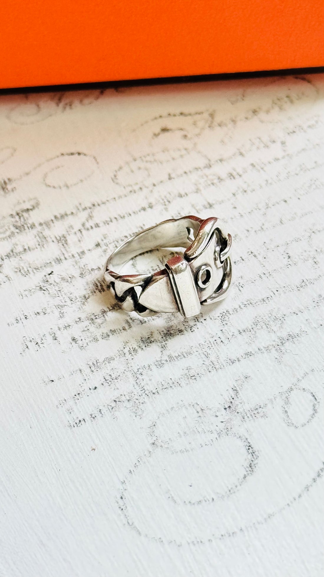 Close-up of Hermès buckle ring in sterling silver