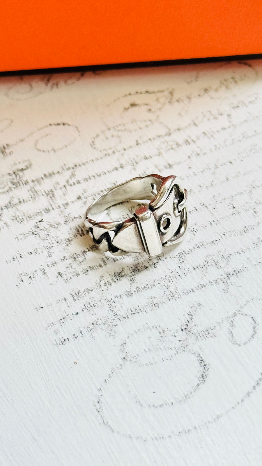 Close-up of Hermès buckle ring in sterling silver