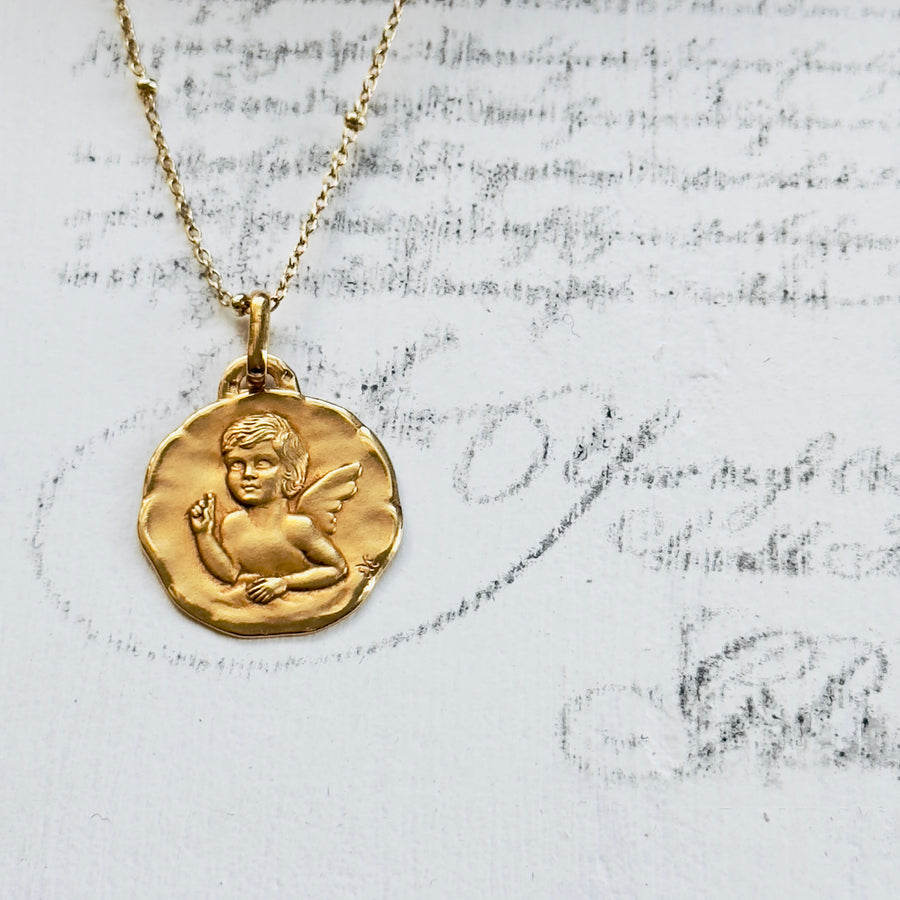 vintage cherub necklace