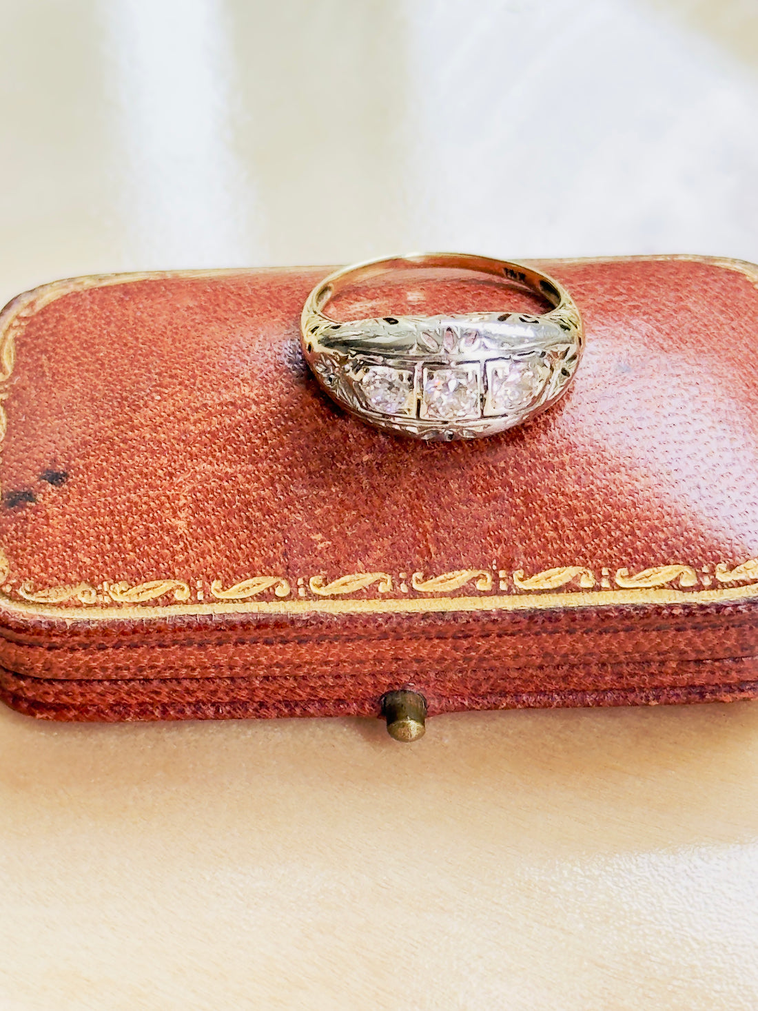 14K gold ring featuring old European-cut and transitional diamonds