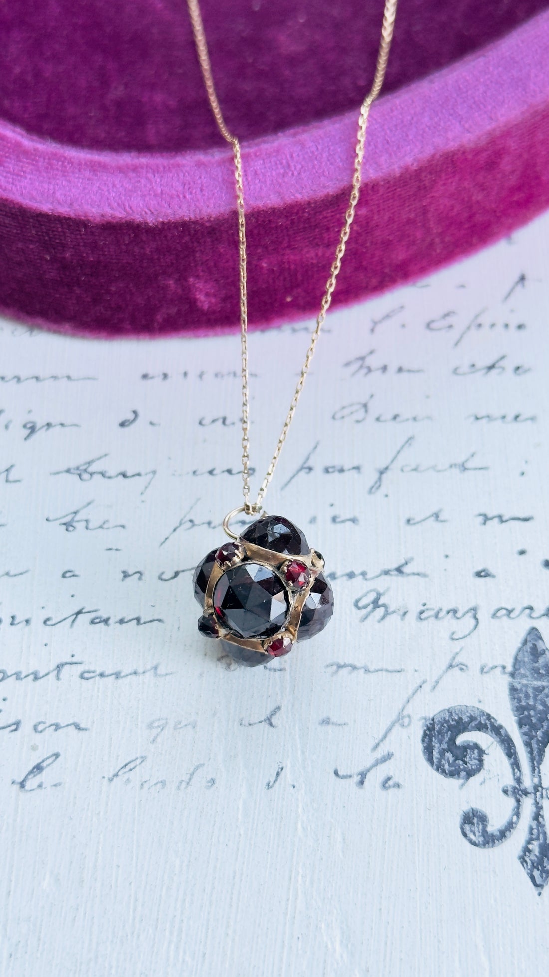 14k gold garnet orb pendant necklace with clustered garnet stones