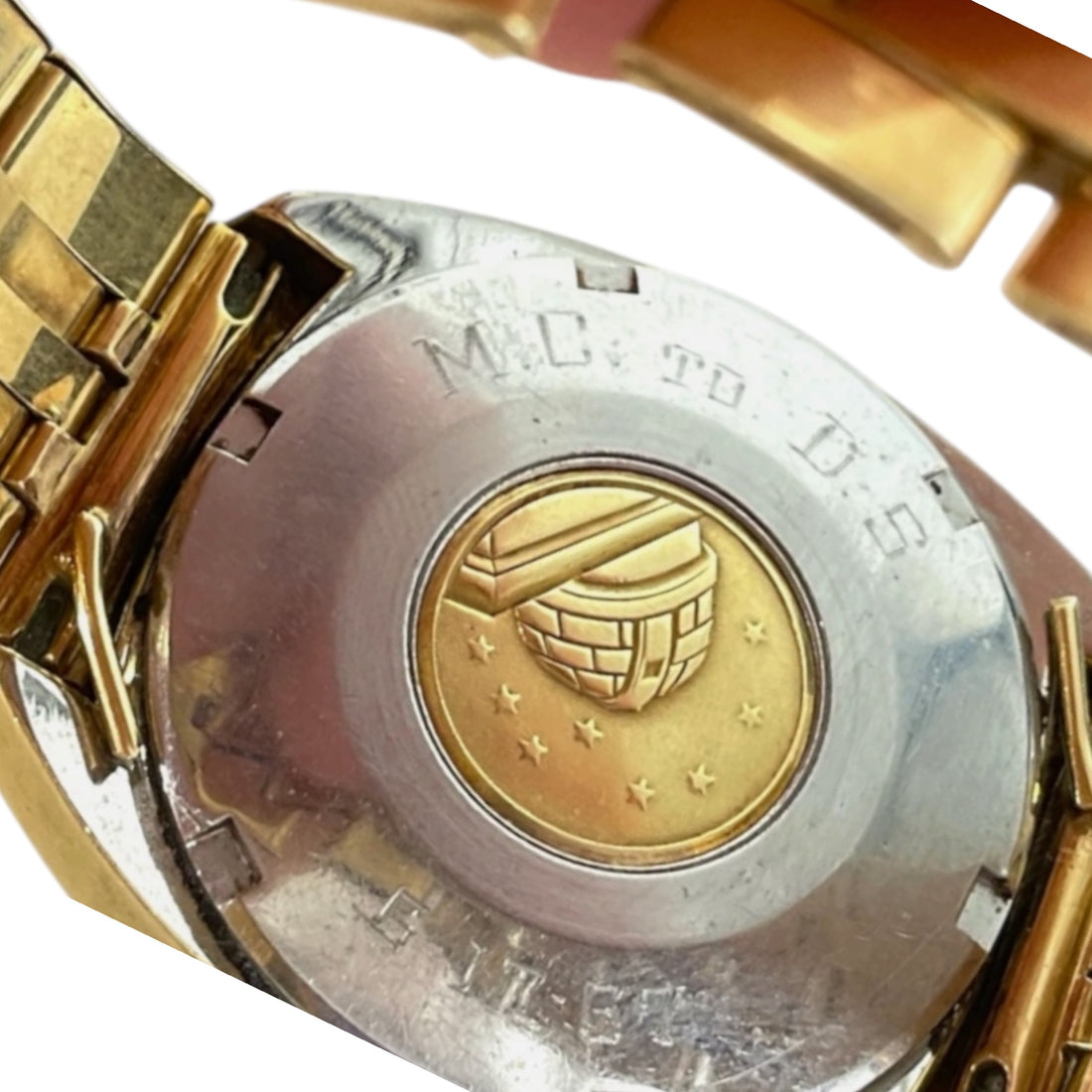 Back of Omega watch showing engraved monogram and 1967 date on case.