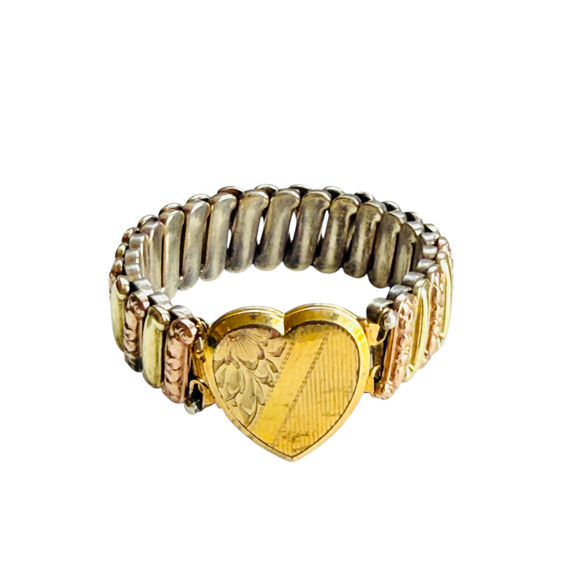 Vintage two-tone sweetheart expansion bracelet with engraved heart locket front on white background.