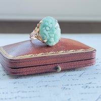 4k gold carved jadeite ring with openwork gallery and floral accents