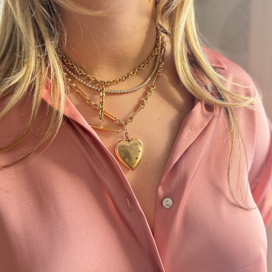 Gold-filled heart locket with starburst paste stone design on paper clip chain