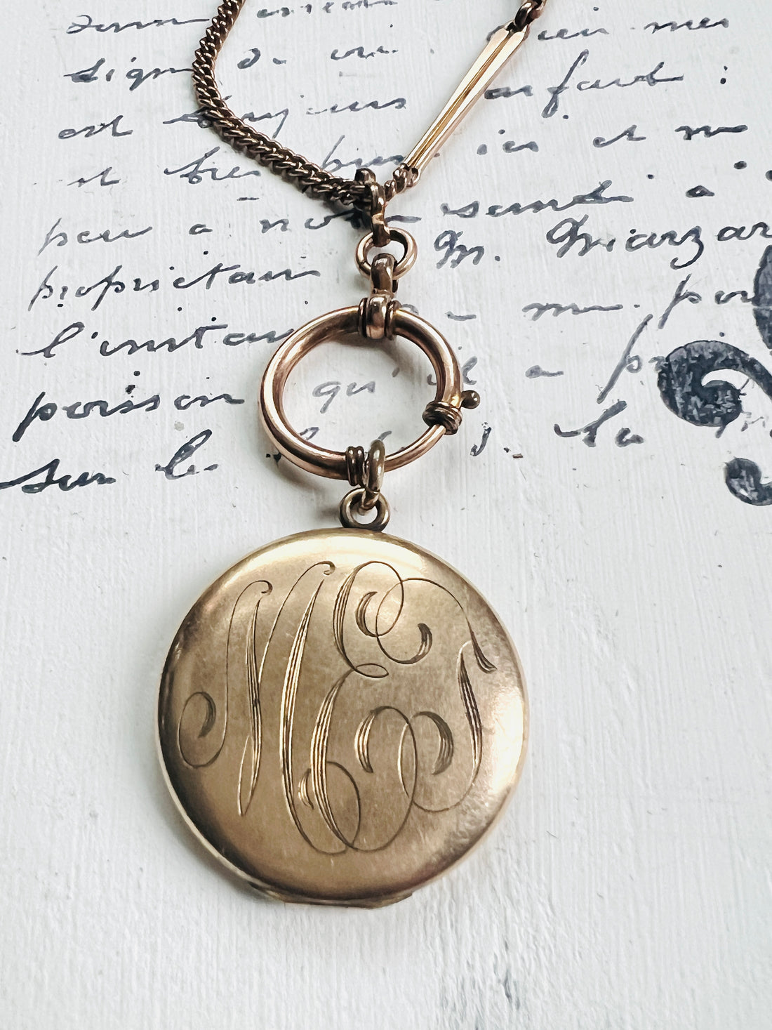 Gold Photo Locket attached to a albert watch chain